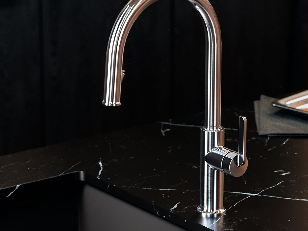 Riobel Authentica kitchen faucet against a black stone surface